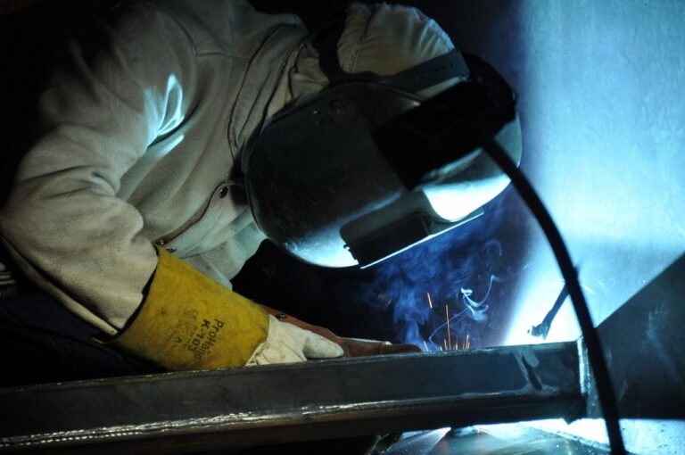 Person Welding a Metal